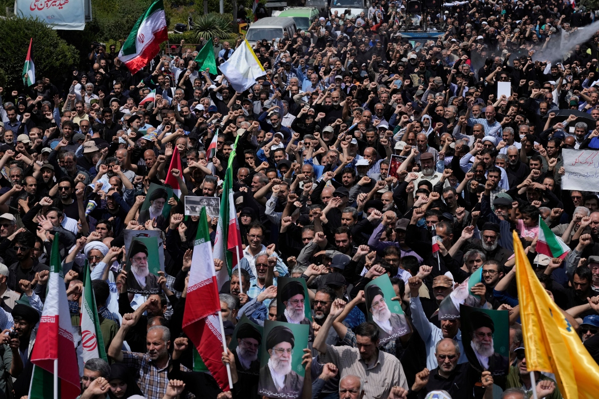 Iranian worshippers chant slogans in an anti-U.S. and anti-Israeli protest after their Friday prayers in Tehran, Iran, Friday, July 25, 2025.