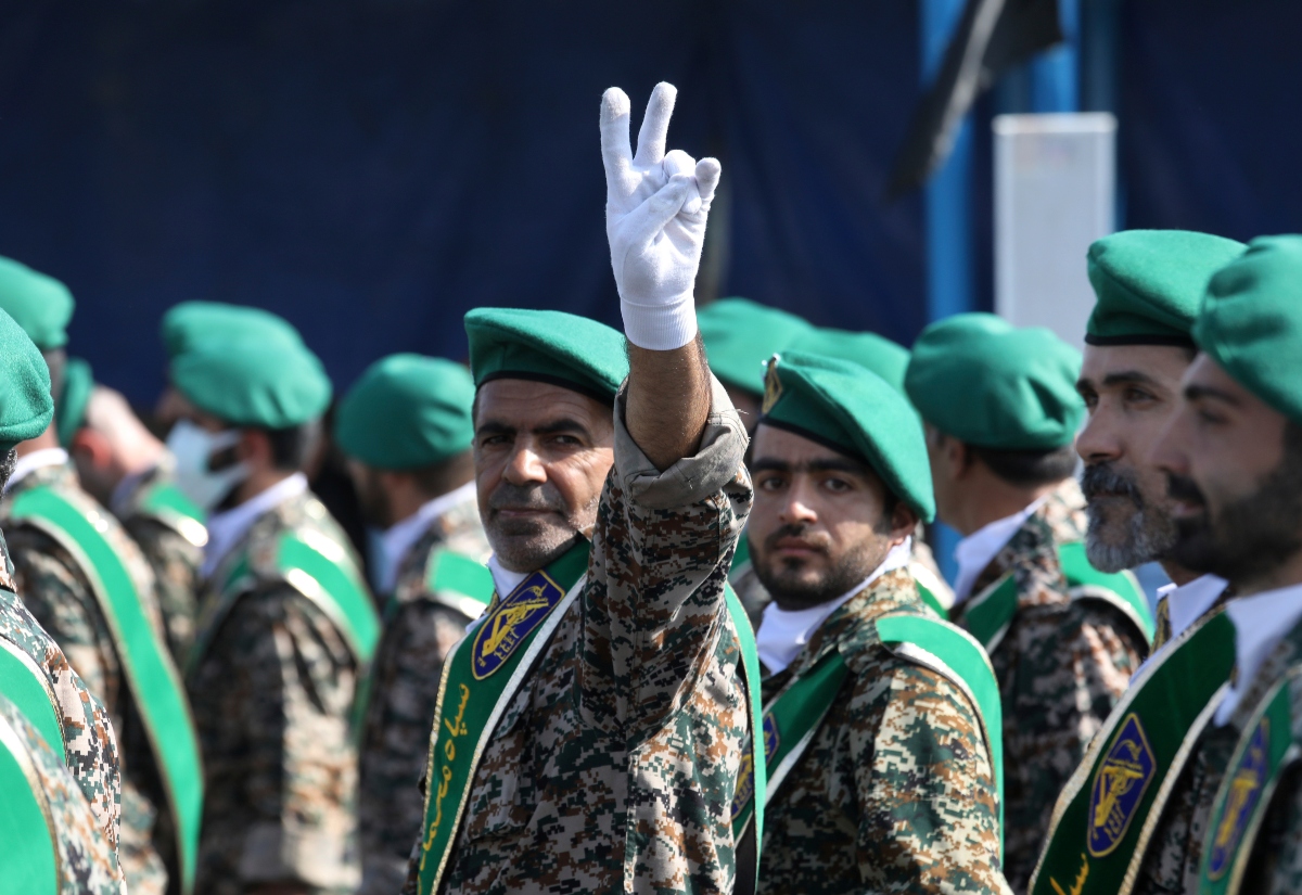 FILE - A member of Iran's paramilitary force flashes a victory sign during a military parade outside of Tehran, Iran, on Sept. 22, 2022