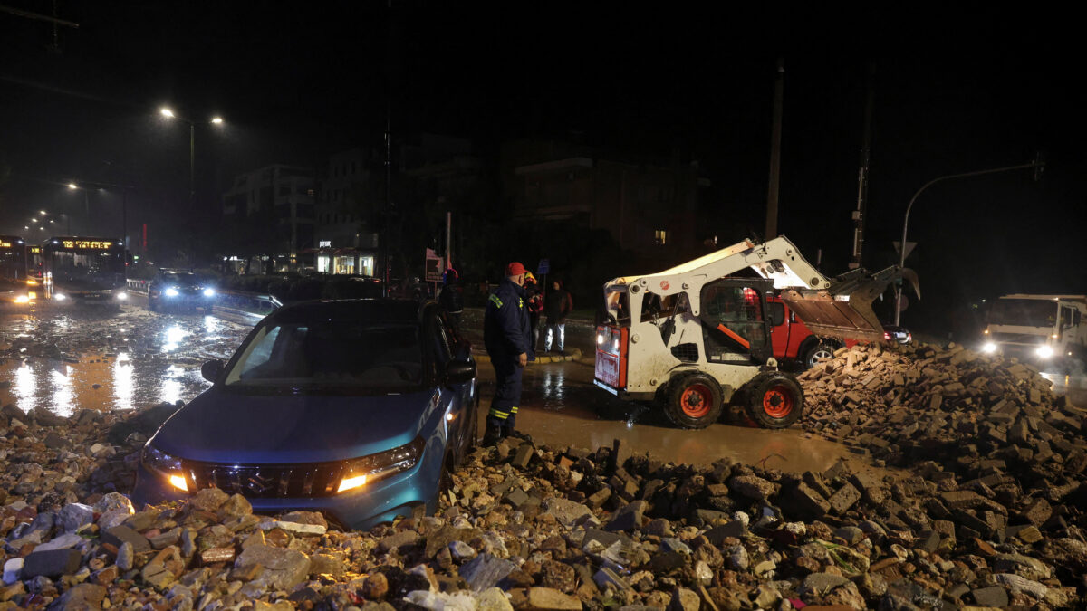A car is partially covered by debris, as a storm hits Athens, Greece, January 21, 2026. REUTERS