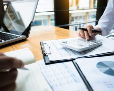 business audits using a calculator financial data investment fund at a workplace, wealth concept