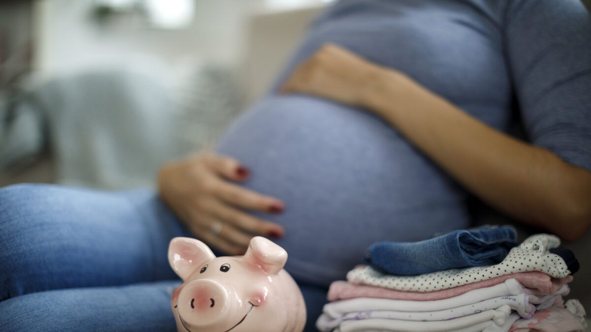 Pregnant woman saving up for baby