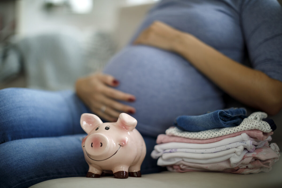 Pregnant woman saving up for baby