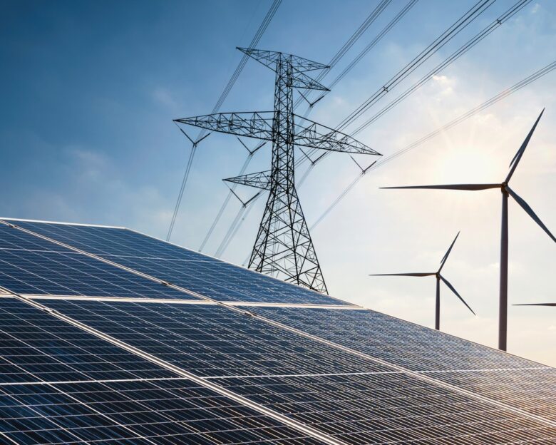 electricity power in nature. clean energy concept. solar panel with turbine and tower hight voltage