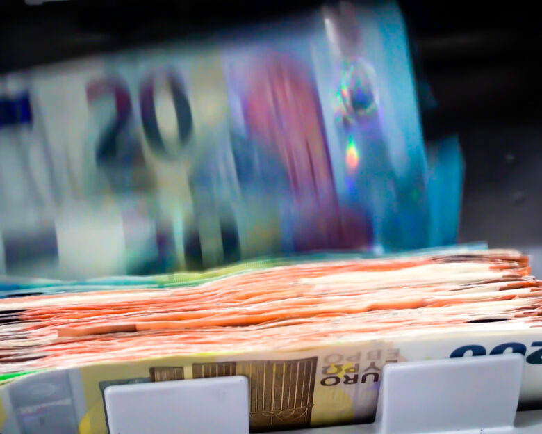 The Euro Currency Banknotes In A Currency Counting Machine.