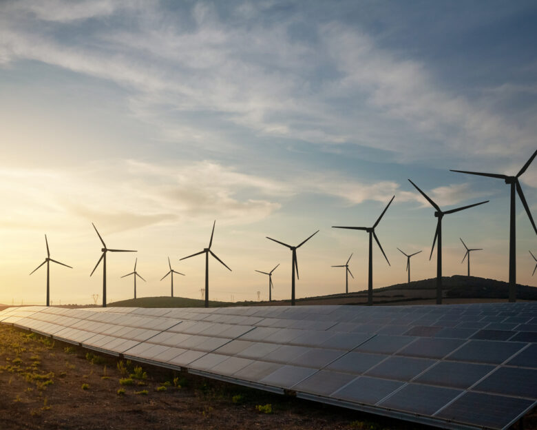Solar panels and wind turbines generating renewable energy for green and sustainable future.