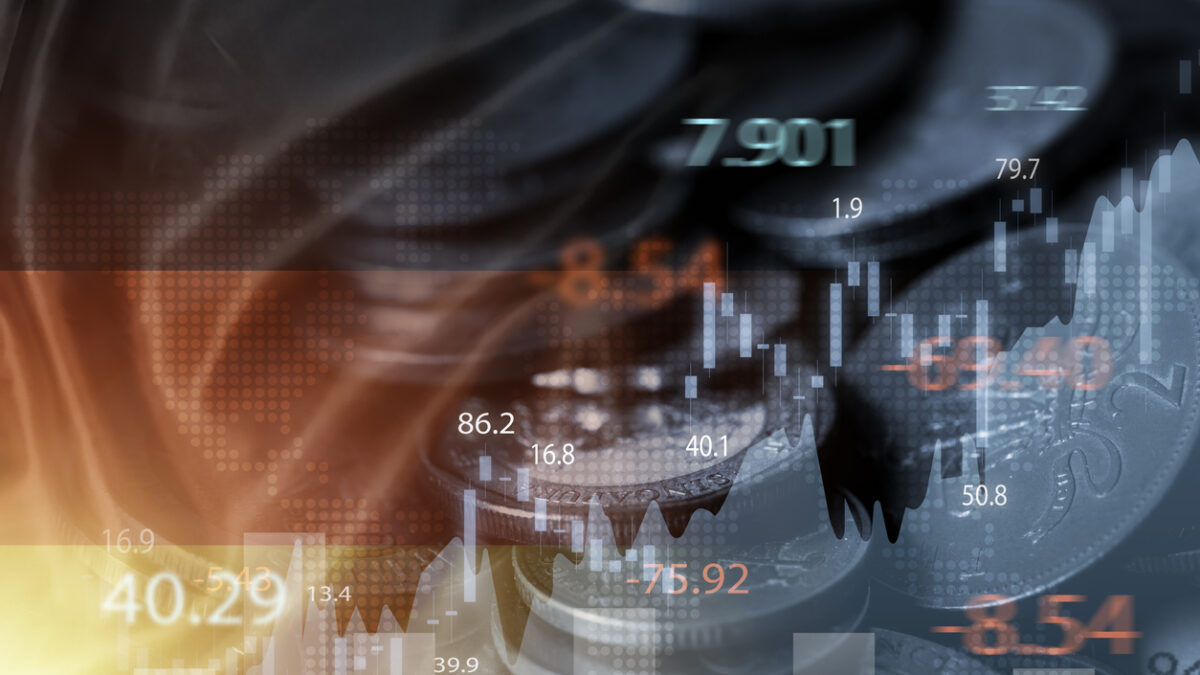 Double exposure of Germany flag on coins stacking and stock market graph chart .It is symbol of Germany high growth economy and investment technology concept.
