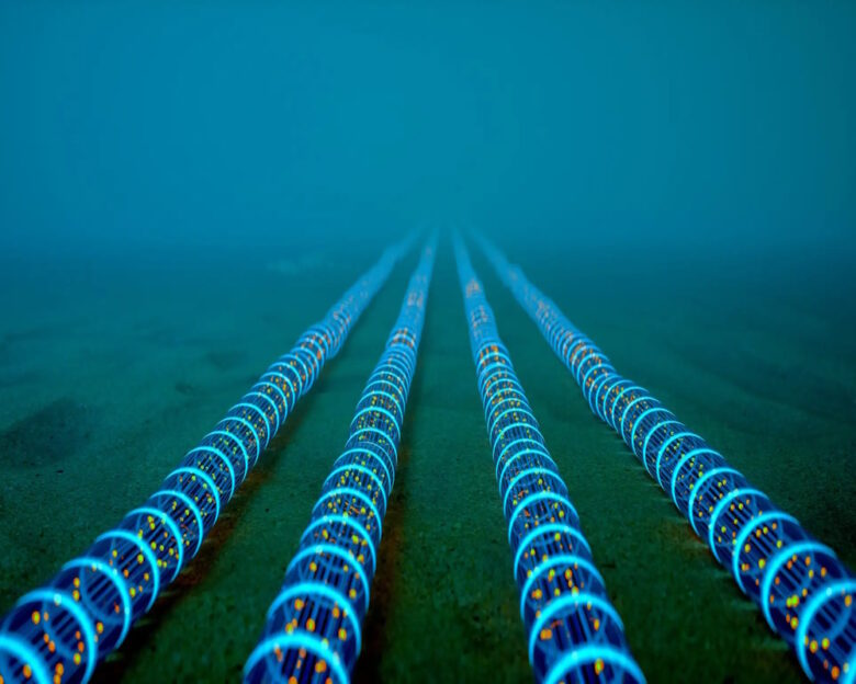 High-tech fiber optic cables glowing with blue light extend into the distance on the ocean floor, symbolizing global communication networks.