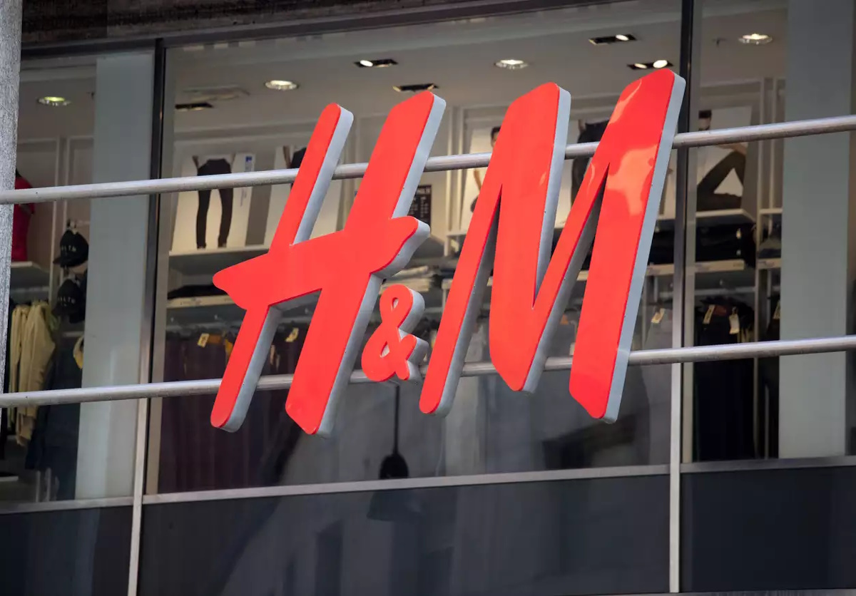 Close up of the logo for the H&M store in Milan, Italy. H&M is a Swedish clothing company with over 2,200 stores worldwide.
