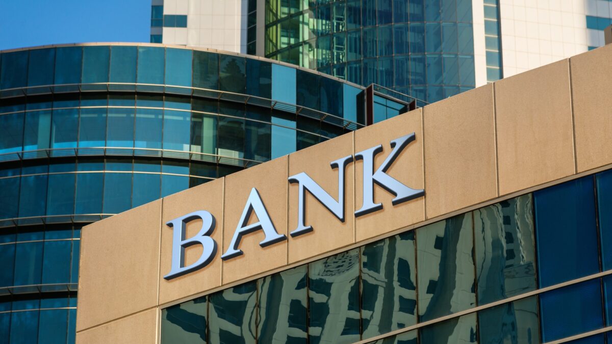 Bank sign on glass wall of business center