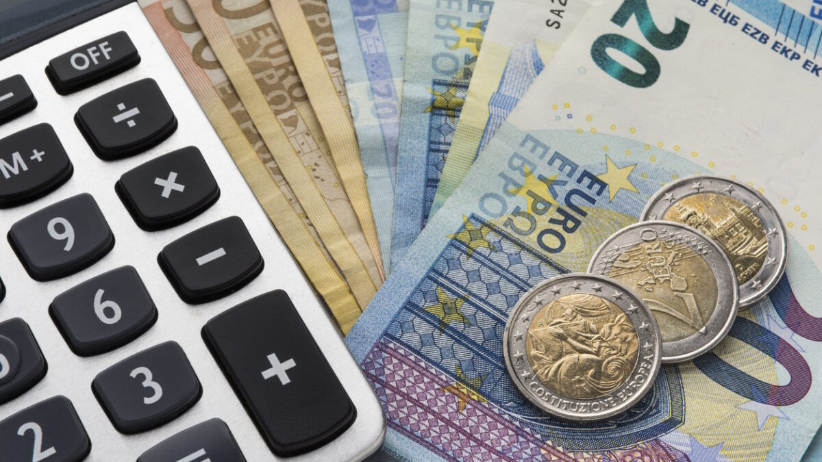 Close up of a calculator and euro money in a financial analyzing concept