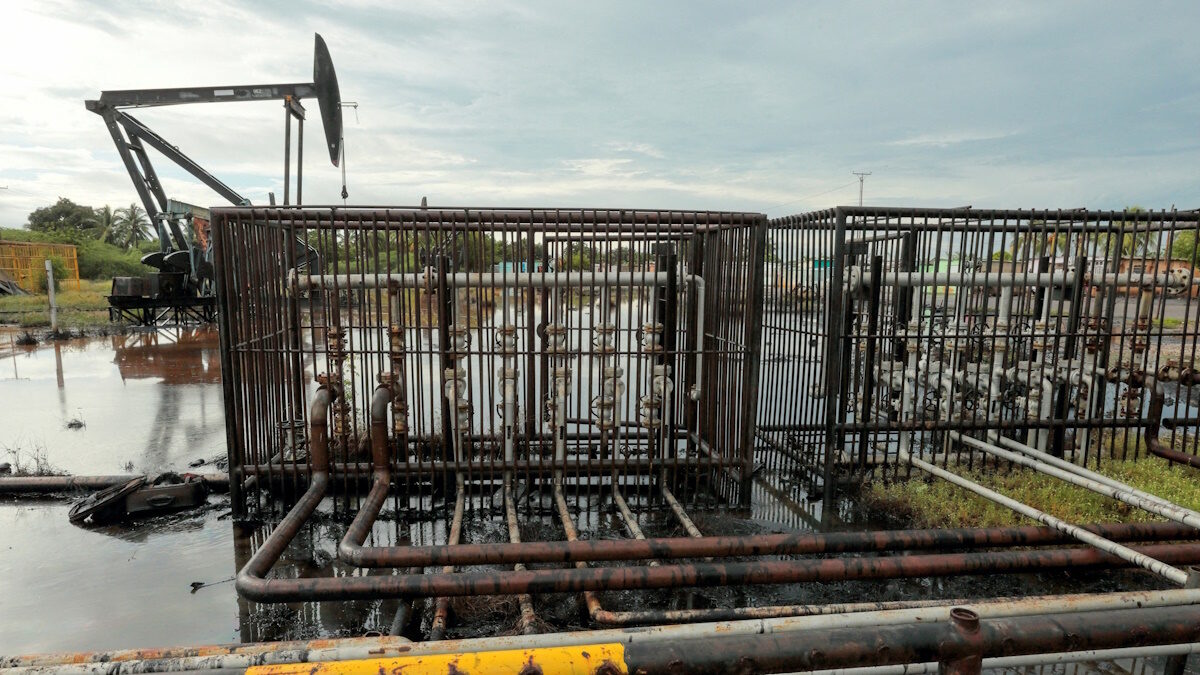 Pipelines and an oil pump jack are seen in an oil field near Lake Maracaibo, in Cabimas, Venezuela October 14, 2022.
