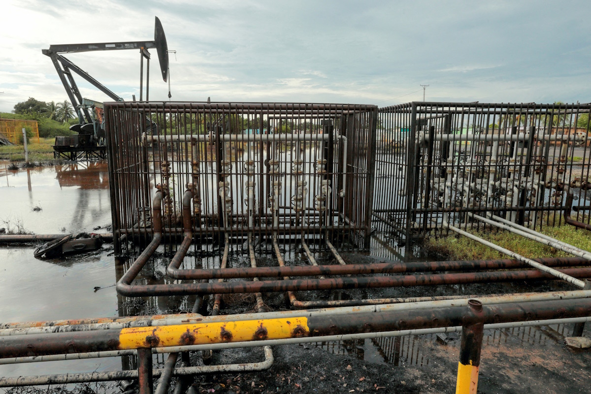 Pipelines and an oil pump jack are seen in an oil field near Lake Maracaibo, in Cabimas, Venezuela October 14, 2022.