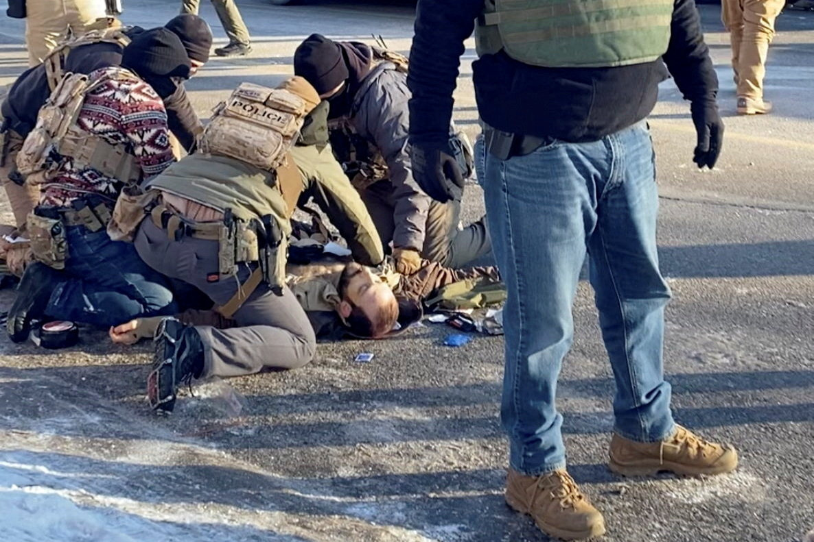 SENSITIVE MATERIAL. THIS IMAGE MAY OFFEND OR DISTURB A screengrab from a video obtained by Reuters shows law enforcement officers kneeling next to the body of a man identified as Alex Pretti who was fatally shot when federal agents were trying to detain him in Minneapolis, Minnesota, U.S., January 24, 2026. VIDEO OBTAINED BY REUTERS