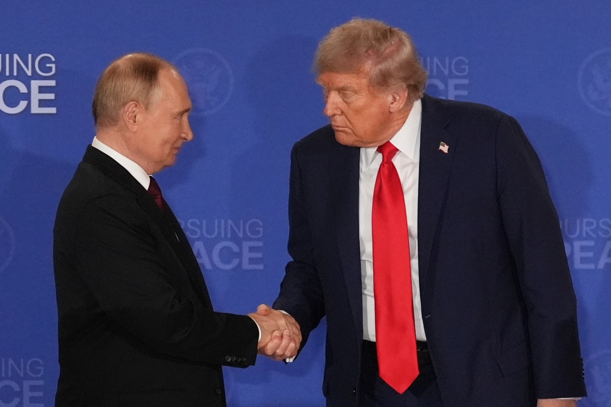 FILE - President Donald Trump, right, shakes the hand of Russia's President Vladimir Putin during a joint press conference at Joint Base Elmendorf-Richardson, Alaska, Aug. 15, 2025. (AP Photo/Jae C. Hong, File)