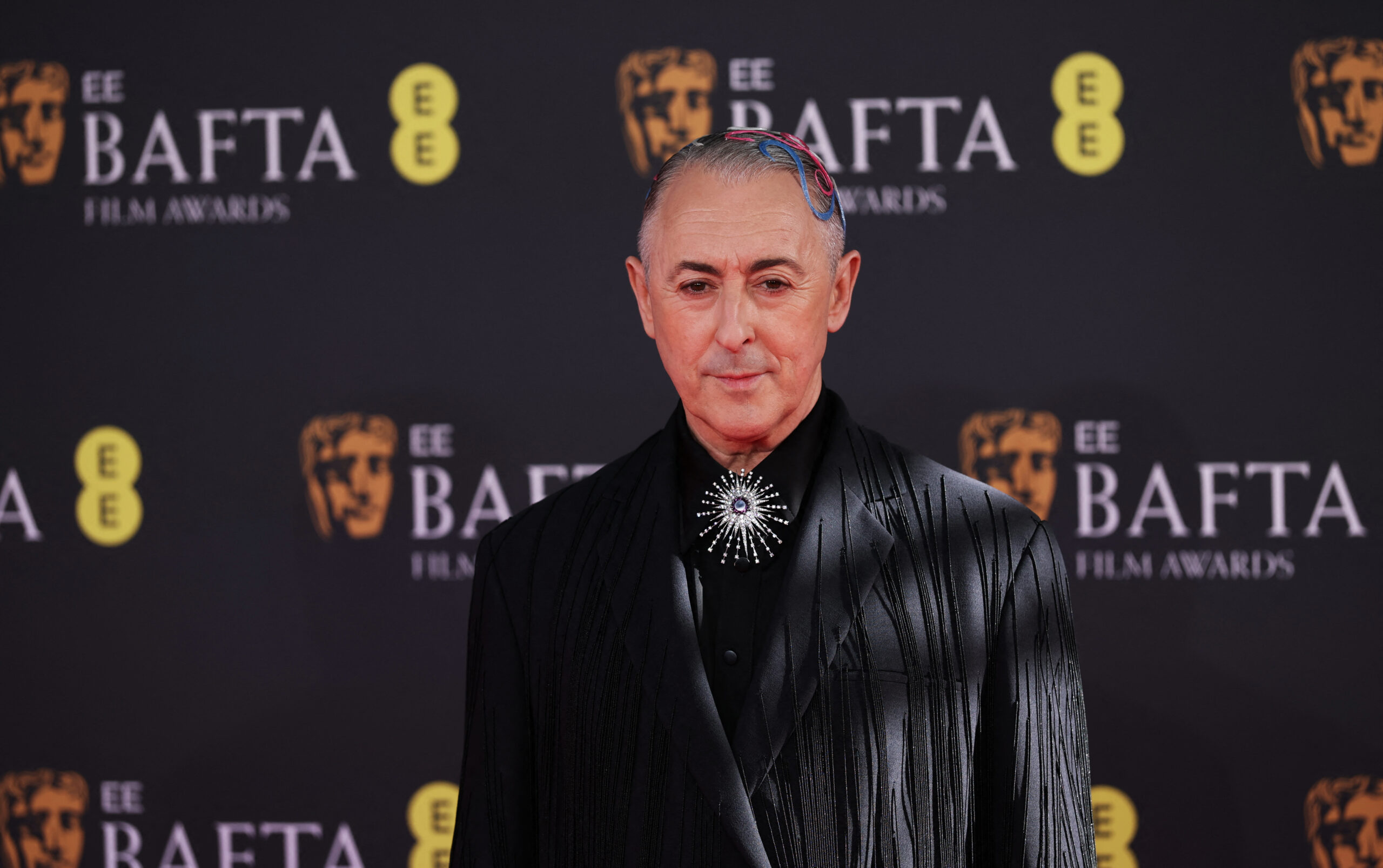 Host Alan Cumming poses at the red carpet during the 2026 British Academy of Film and Television Awards (BAFTA) at the Royal Festival Hall in the Southbank Centre, London, Britain, February 22, 2026. REUTERS