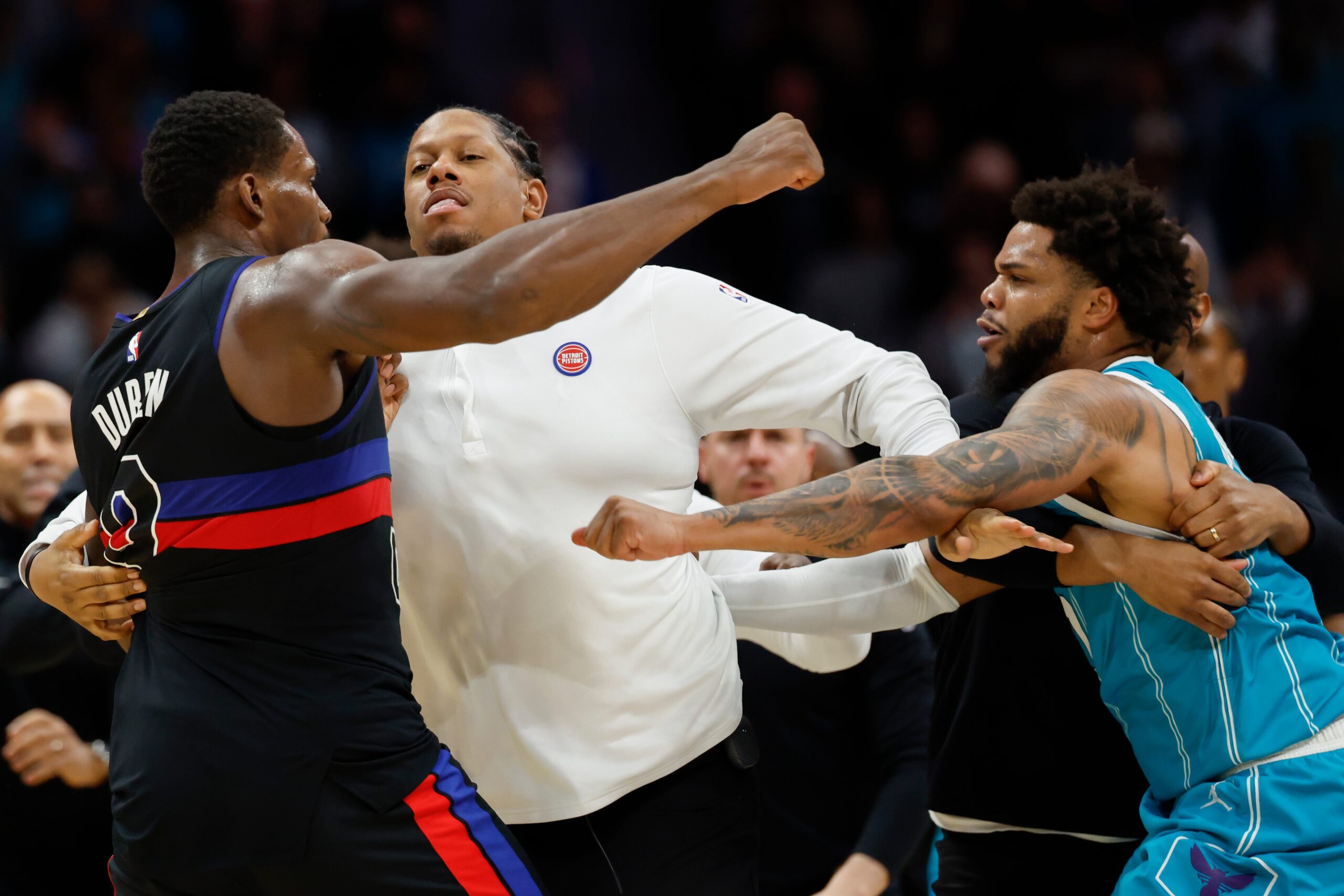 Detroit Pistons center Jalen Duren, left, throws punches with Charlotte Hornets forward Miles Bridges, right, during a fight on the court in the second half of an NBA basketball game in Charlotte, N.C., Monday, Feb. 9, 2026. (AP Photo