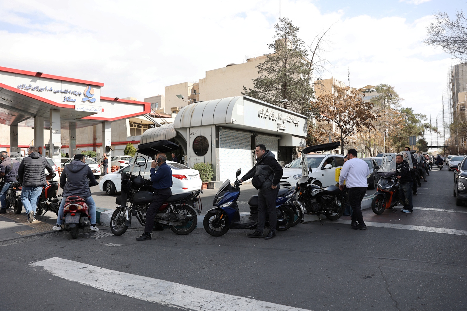 Aftermath of strike in Tehran People wait for their turn at a fuel station, after Israel and the U.S. launched strikes on Iran, in Tehran, Iran, February 28, 2026. Majid Asgaripour/WANA (West Asia News Agency) via REUTERS ATTENTION EDITORS - THIS PICTURE WAS PROVIDED BY A THIRD PARTY