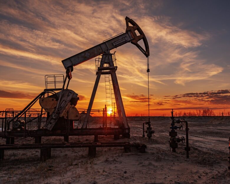 Oil pump rig. Oil and gas production. Oilfield site. Pump Jack are running. Drilling derricks for fossil fuels output and crude oil production. Global coronavirus COVID 19 crisis. War on oil prices