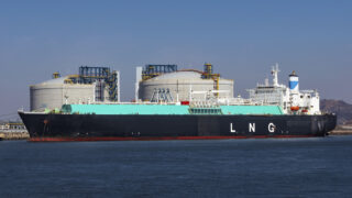 LNG (Liquefied natural gas) tanker ship unloading its cargo at LNG terminal