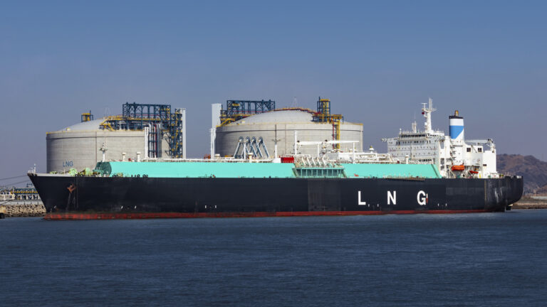 LNG (Liquefied natural gas) tanker ship unloading its cargo at LNG terminal