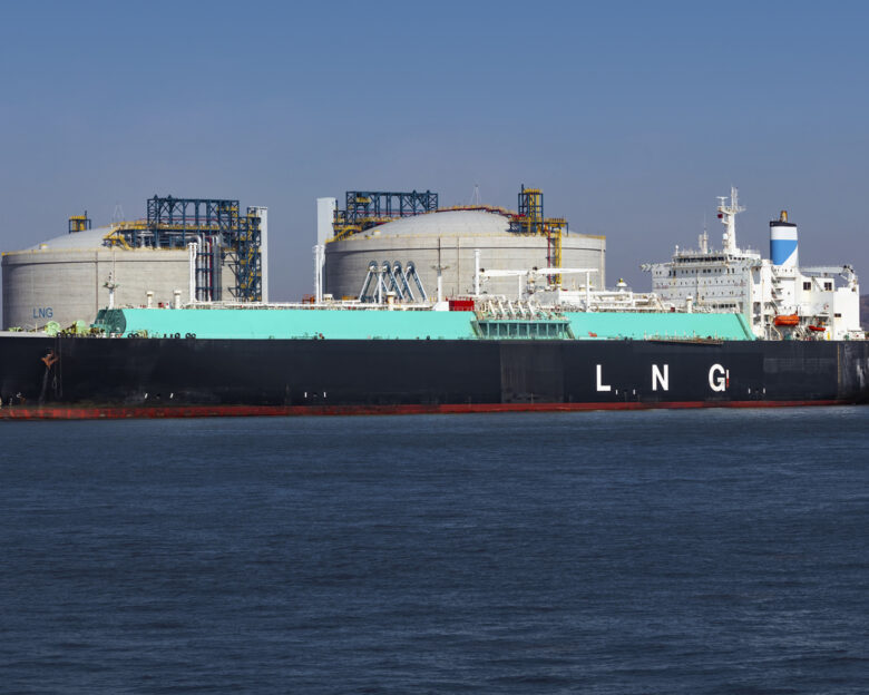 LNG (Liquefied natural gas) tanker ship unloading its cargo at LNG terminal