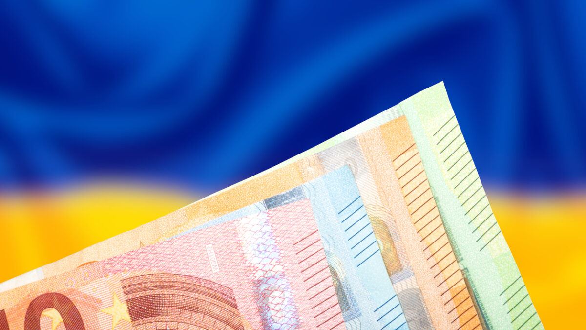 Flag of Ukraine and wallet with euro banknotes