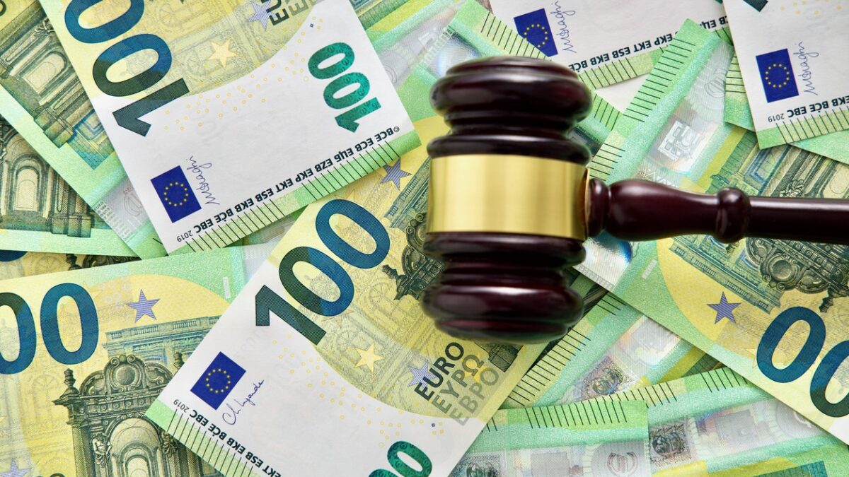 udge or auctioneer gavel on a euro money background