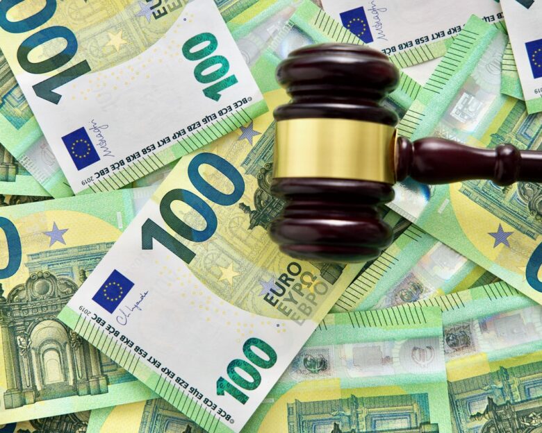 udge or auctioneer gavel on a euro money background