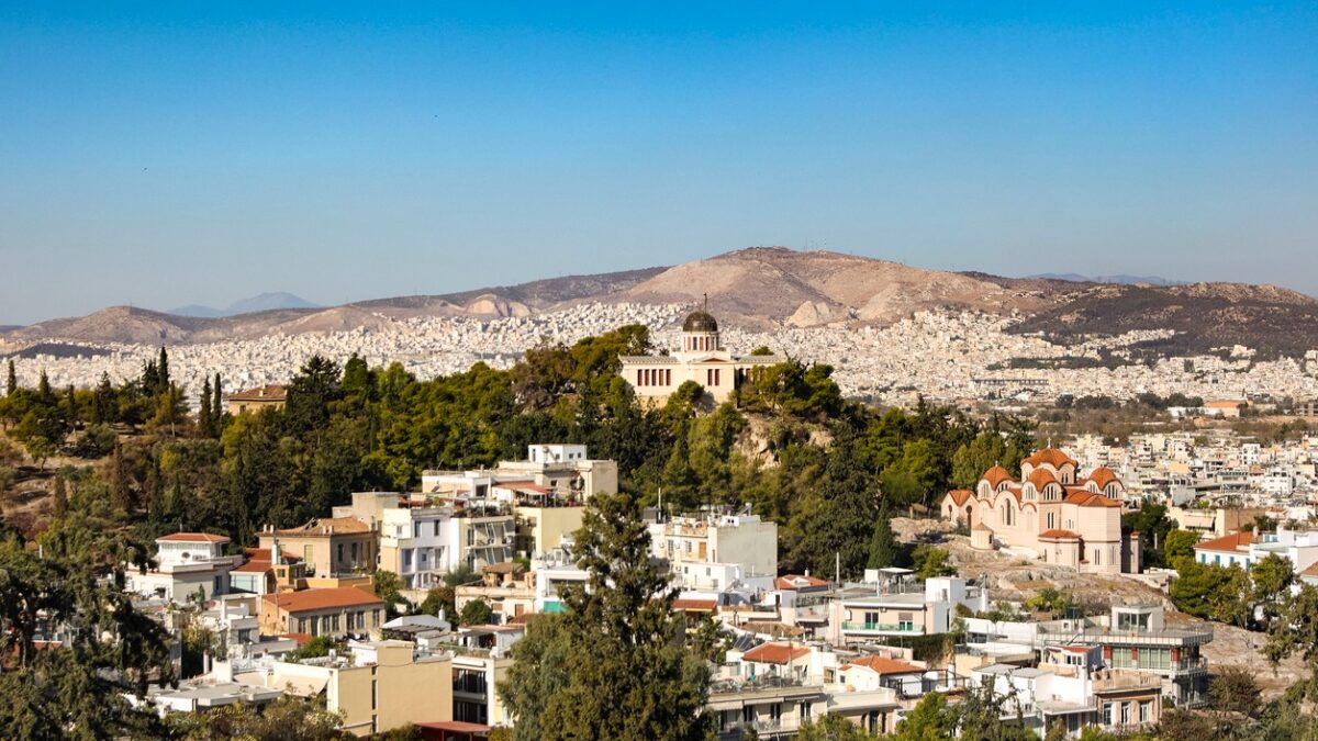 High angle view of National Observatory of Athens (Thissio Visitor Center) and Church of Agia Marina in Athens, Greece.