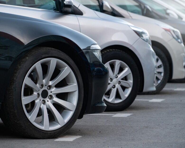 A lot of cars in a rows. Used car sales.