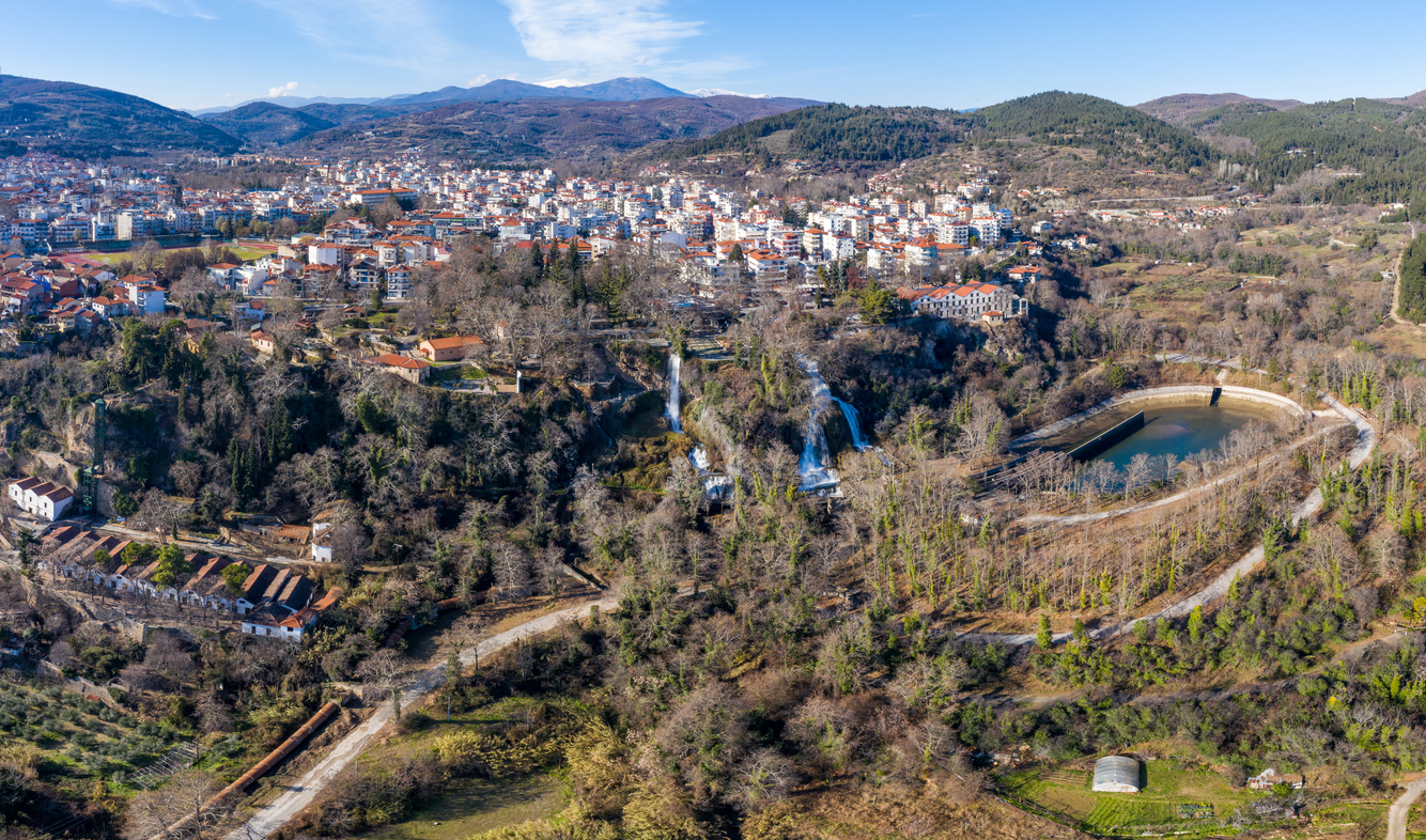 the famous Edessa Waterfalls in northern Greece. Crystal-clear water cascades down lush green cliffs, creating one of the most beautiful natural attractions in Greece. Perfect travel destination and nature landscape footage."