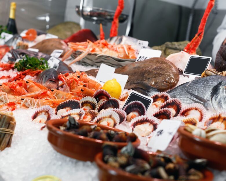 Large assortment of fresh seafoods suiting any taste on icy showcase