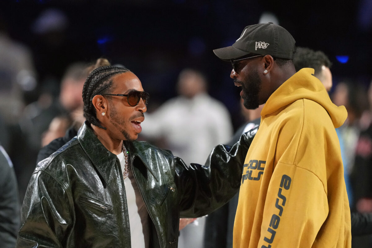 Feb 15, 2026; Inglewood, California, USA; Ludacris (left) talks with Dwayne Wade during the 75th NBA All Star Game at Intuit Dome. during the 75th NBA All Star Game at Intuit Dome. Mandatory Credit: Kirby Lee-Imagn Images