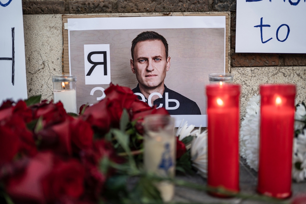 Several flowers and candles next to a photo of Alexei Navalni, during a rally for the death of Alexei Navalni, at the Russian Embassy in Madrid, February 16, 2024, in Madrid, Spain. The Russian opposition leader, Alexei Navalni, has died in a prison in Jarp, in the Arctic Circle, according to the Russian prison authorities themselves. The same sources assure that he has suffered a fainting spell after his daily walk and although the necessary resuscitation procedures were performed, they did not produce any results. Navalni, 47 years old, was serving 30 years in prison for various crimes, and was considered the main opponent of Putin and the Kremlin's policies. FEBRUARY 16;2024 Diego Radamés / Europa Press 02/16/2024 (Europa Press via AP)