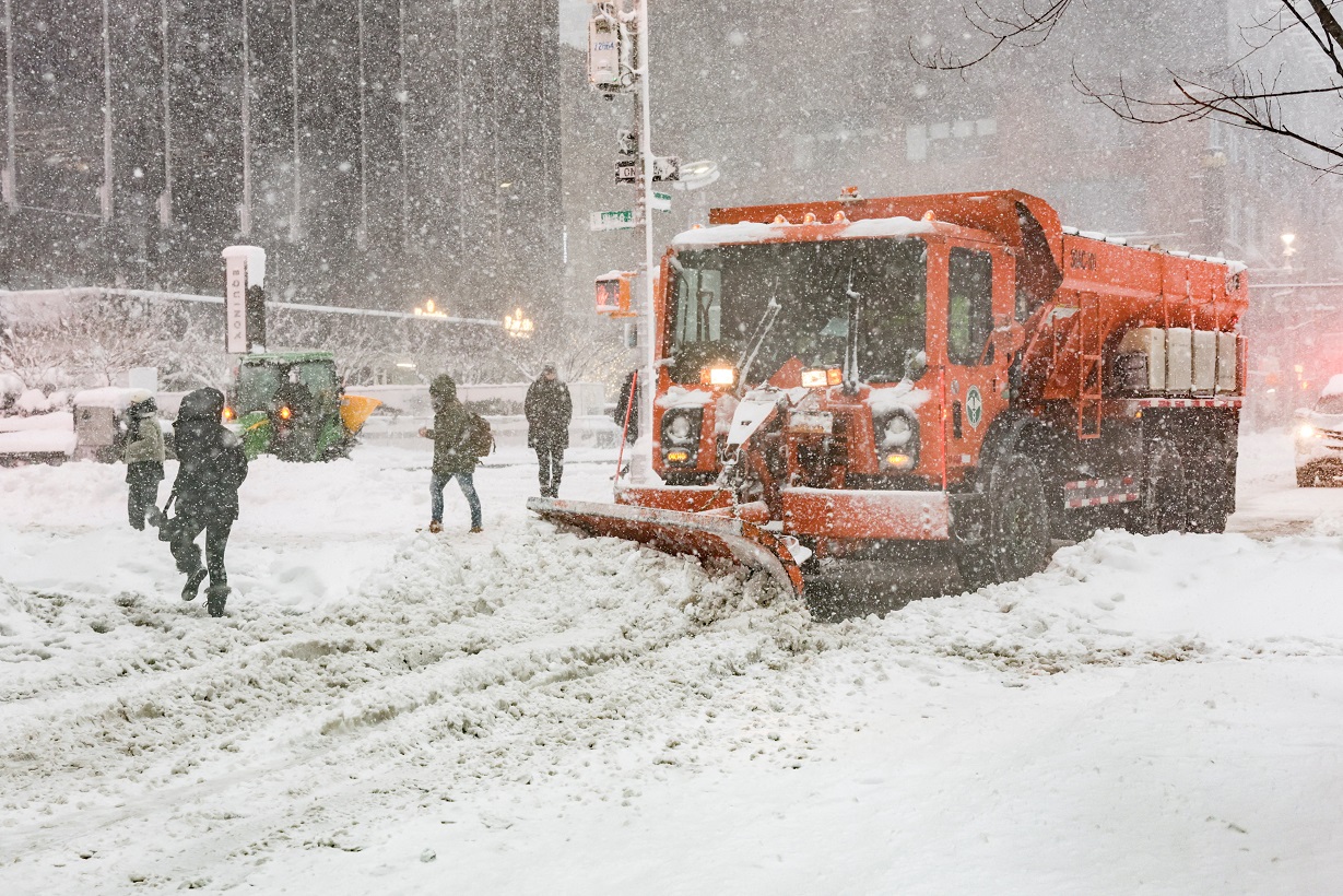 A snow plow vehicle clears snow on a street as snow falls during a winter storm in New York City, U.S., February 23, 2026. REUTERS