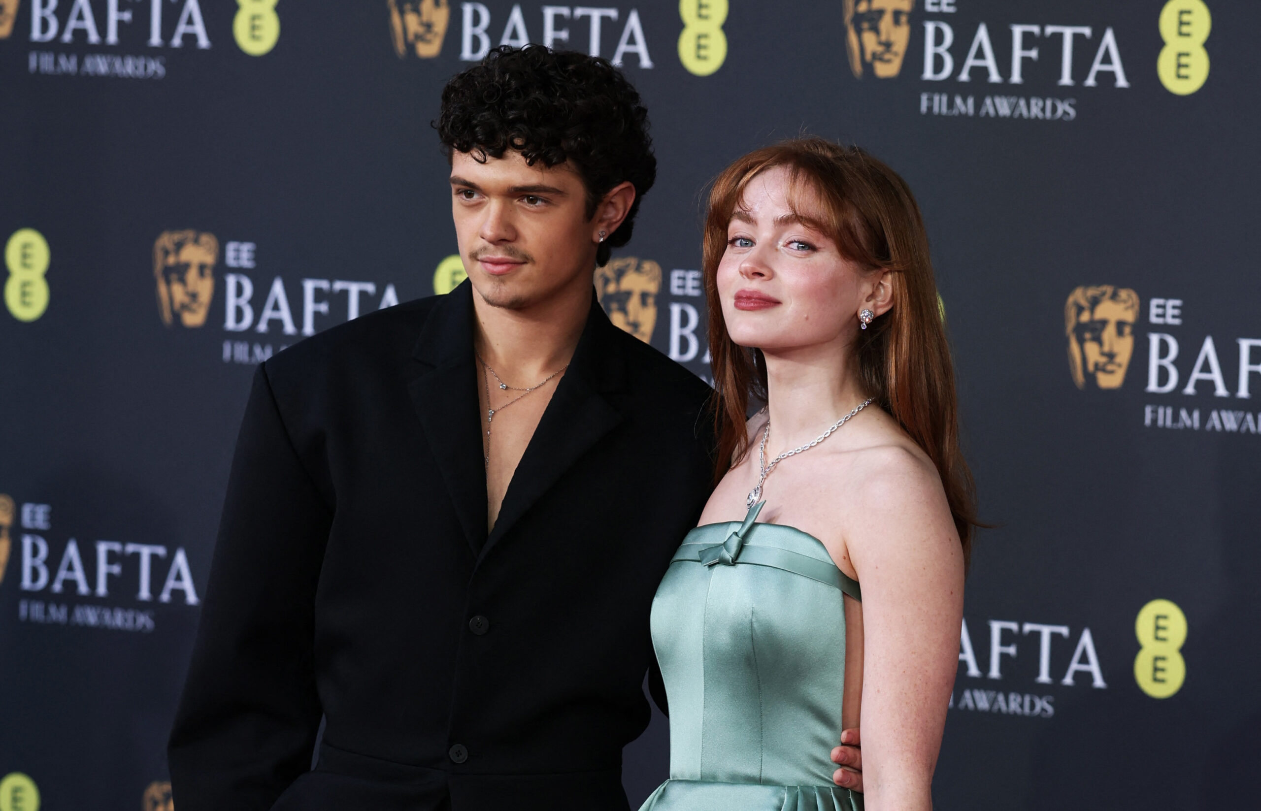 Noah Jupe and Sadie Sink pose on the red carpet during the 2026 British Academy of Film and Television Awards (BAFTA) at the Royal Festival Hall in the Southbank Centre, London, Britain, February 22, 2026. REUTERS