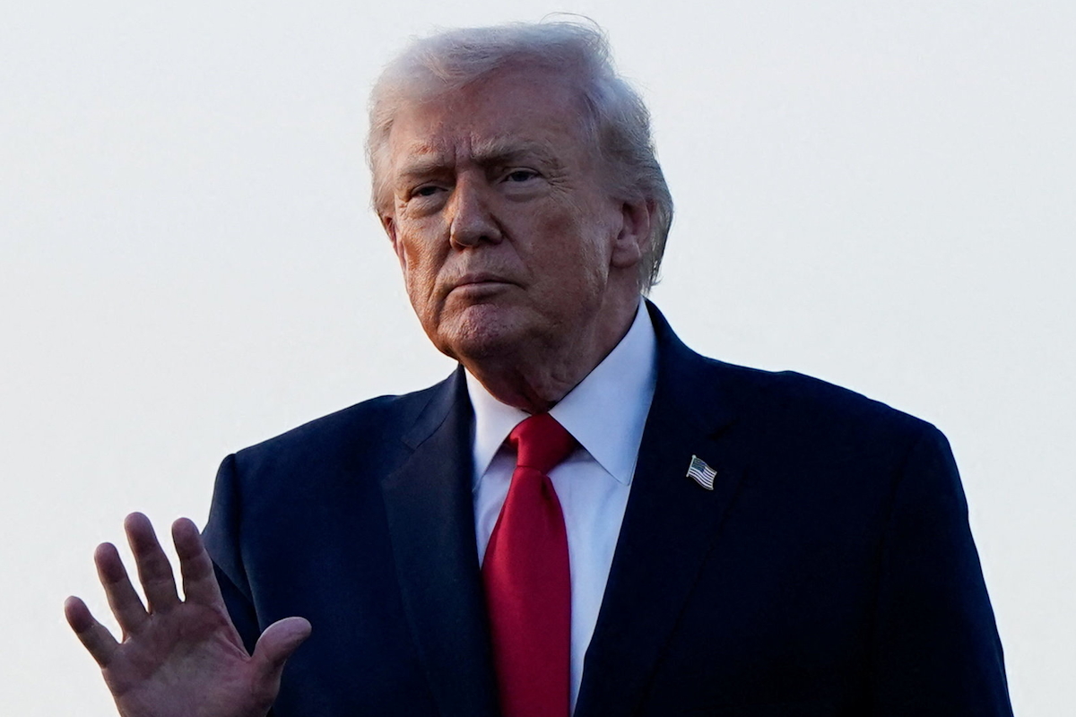 U.S. President Donald Trump gestures as he arrives at Palm Beach International Airport in West Palm Beach, Florida, U.S., February 13, 2026. REUTERS