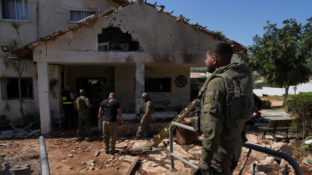 Israeli soldiers work at a house that was damaged by a barrage of rockets fired by Lebanon's Iran-backed Hezbollah into Israel, amid the U.S.-Israel conflict with Iran, near Israel's border with Lebanon in northern Israel, March 3, 2026. REUTERS/Ayal Margolin ISRAEL OUT. NO COMMERCIAL OR EDITORIAL SALES IN ISRAEL