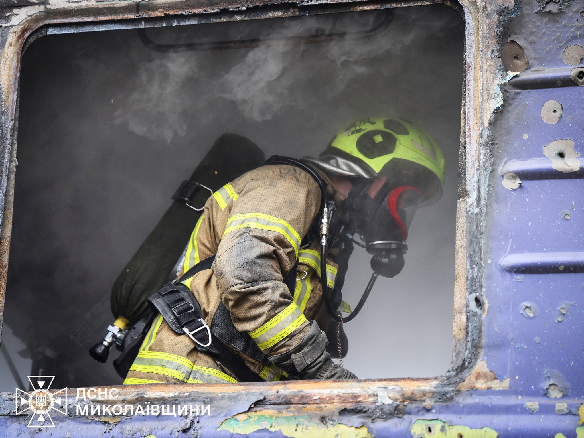 A firefighter works in a passenger train after it was hit by a Russian drone strike, amid Russia's attack on Ukraine, at a railway station in Mykolaiv region, Ukraine March 4, 2026. Press service of the State Emergency Service of Ukraine in Mykolaiv region/Handout via REUTERS ATTENTION EDITORS - THIS IMAGE HAS BEEN SUPPLIED BY A THIRD PARTY. DO NOT OBSCURE LOGO.