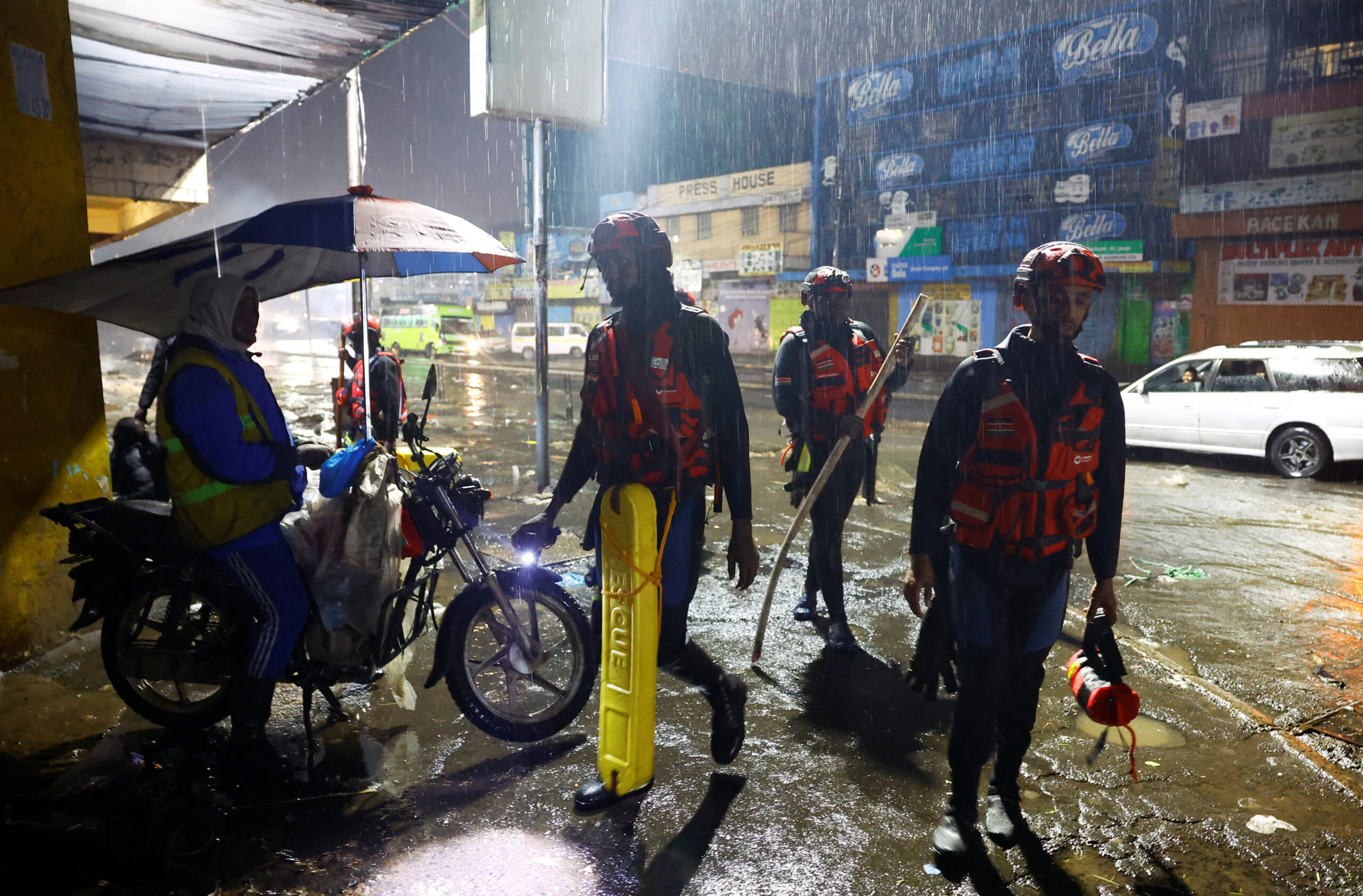 Members of the Kenya Red Cross search for missing persons following heavy rainfall in the Grogan area, popular for automotive workshops and secondhand spare parts in downtown Nairobi, Kenya, March 7, 2026. REUTERS/Thomas Mukoya