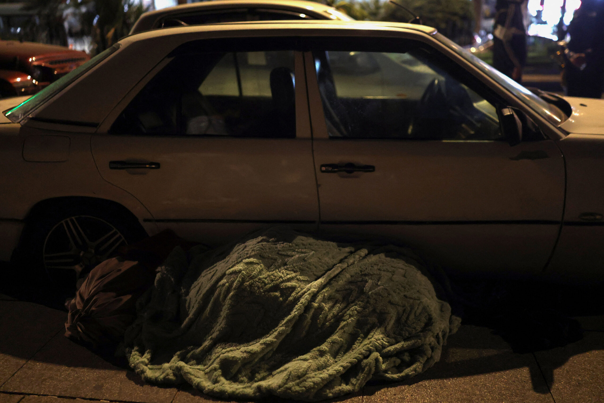 Displaced people in Beirut, following an escalation between Hezbollah and Israel, amid the U.S.-Israeli conflict with Iran A blanket covers personal items nearby a car, as displaced people have been living along the Corniche, following an escalation between Hezbollah and Israel amid the U.S.-Israeli conflict with Iran, in Beirut, Lebanon, March 10, 2026. REUTERS/Claudia Greco