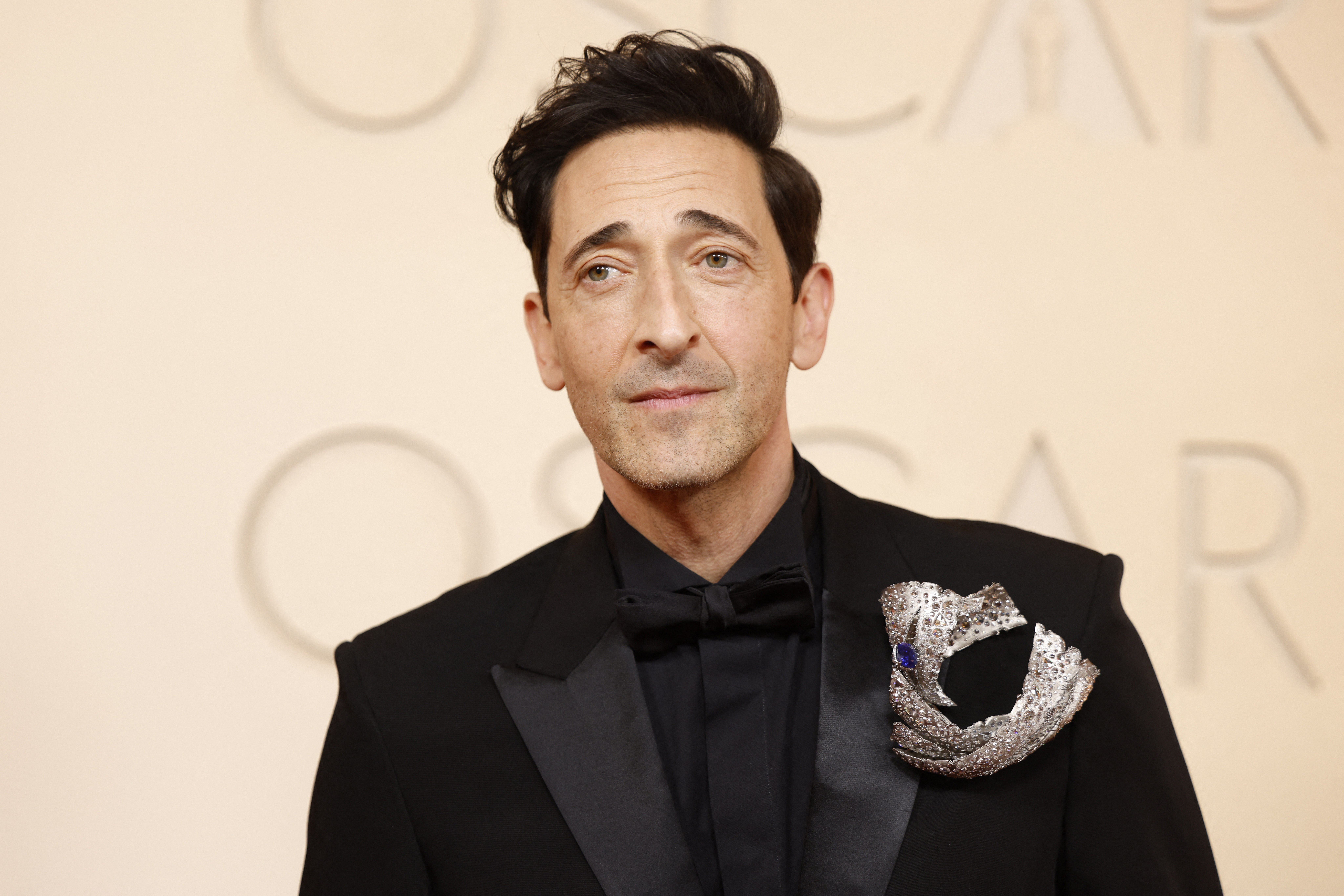 Adrien Brody poses on the red carpet during the Oscars arrivals at the 98th Academy Awards in Hollywood, Los Angeles, California, U.S., March 15, 2026. REUTERS