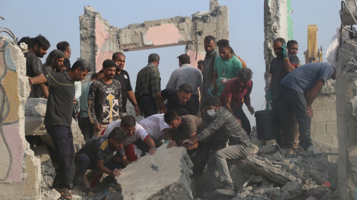 Rescue workers and residents search through the rubble in the aftermath of what Iranian officials said was an Israeli-U.S. strike on a girls' elementary school in Minab, Iran, Saturday, Feb. 28, 2026. (Abbas Zakeri/Mehr News Agency via AP)