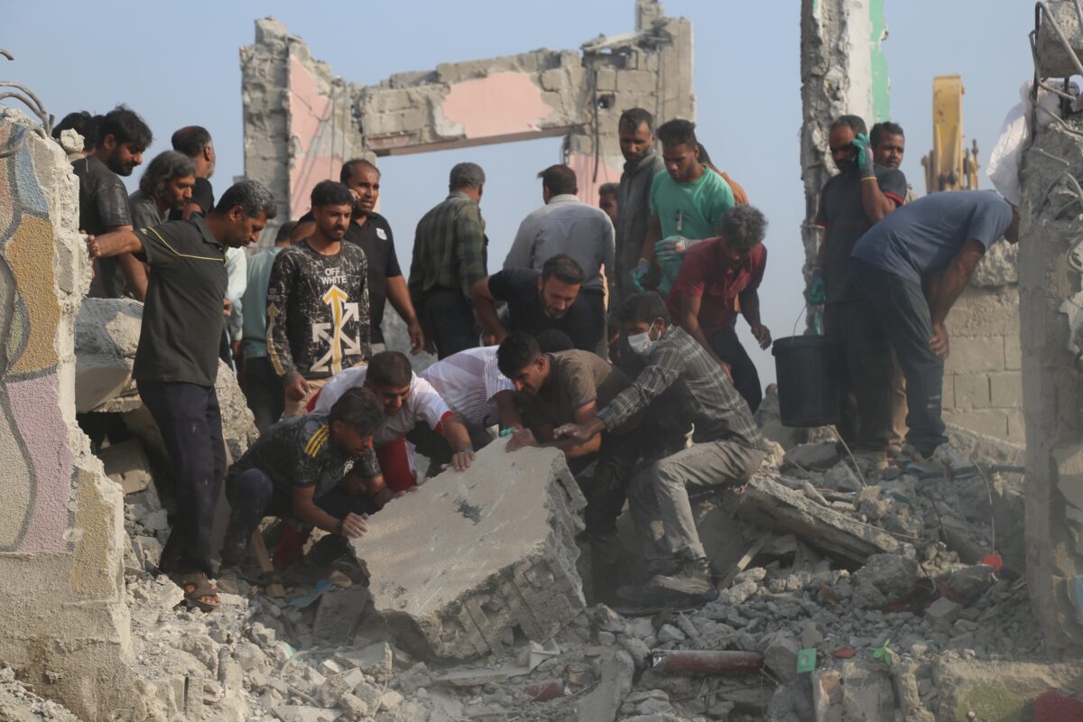 Rescue workers and residents search through the rubble in the aftermath of what Iranian officials said was an Israeli-U.S. strike on a girls' elementary school in Minab, Iran, Saturday, Feb. 28, 2026. (Abbas Zakeri/Mehr News Agency via AP)