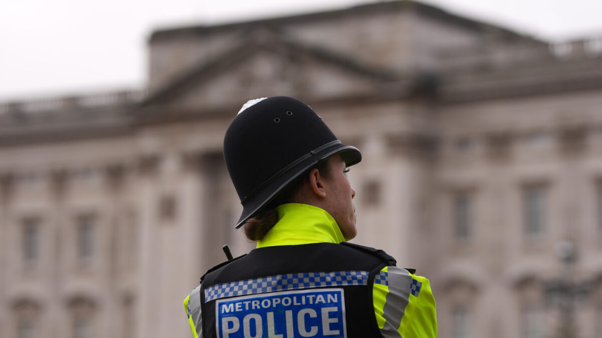 A police officer stands in front of Buckingham Palace in London, Friday, Feb. 20, 2026 after Andrew Mountbatten-Windsor was arrested and held for hours by British police on suspicion of misconduct in public office related to his links to Jeffrey Epstein.(AP Photo/Kin Cheung)