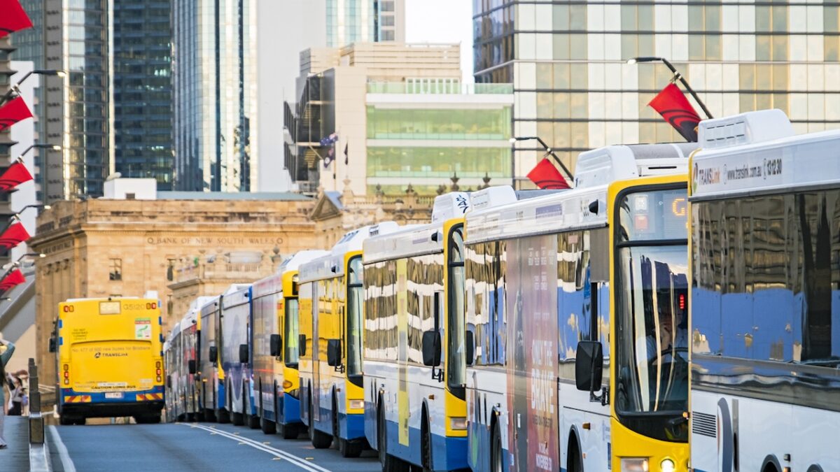 Brisbane, Australia - November 21, 2017: Rush hour congestion on Brisbane's Victoria Bridge with long line of buses stopped on dedicated busway, with city in background.