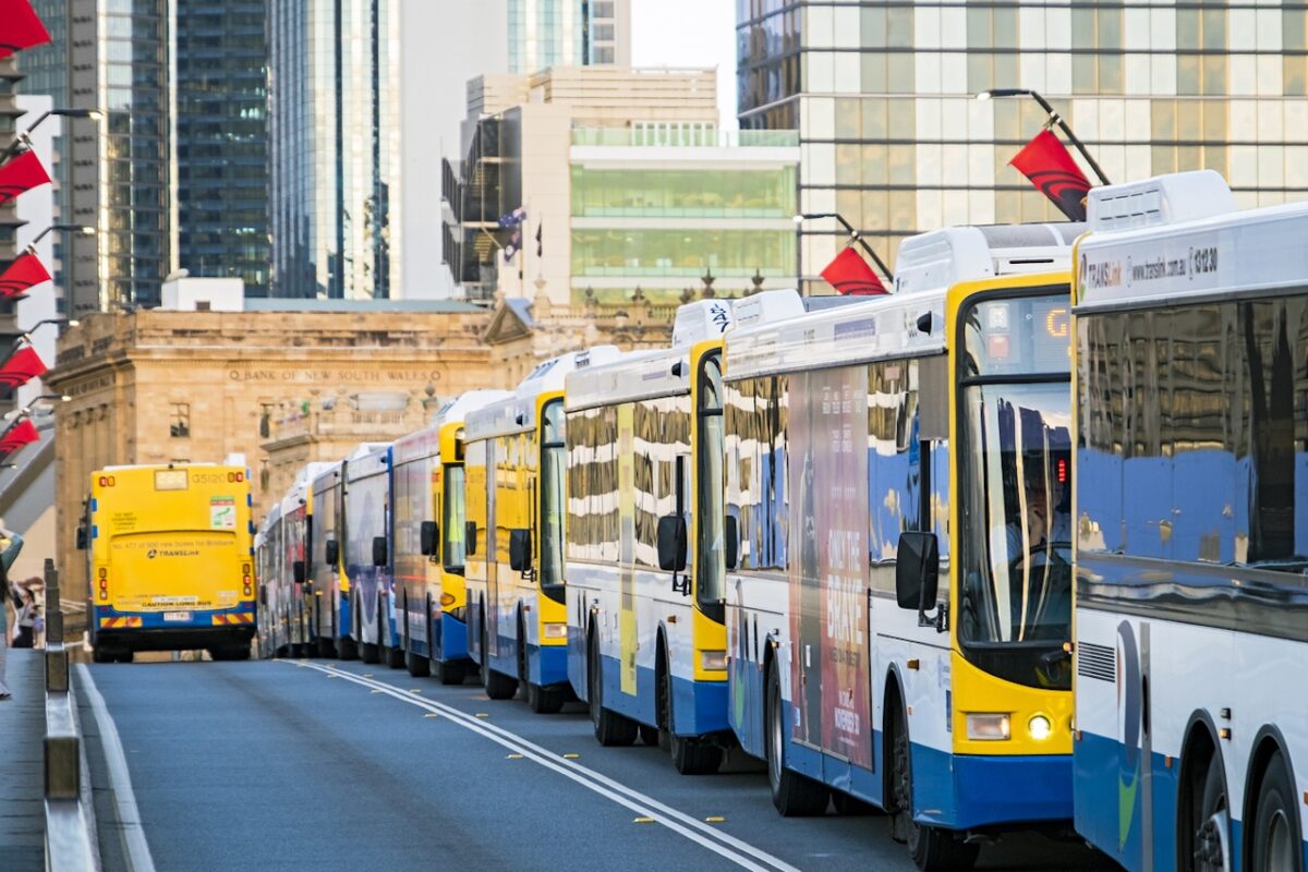 Brisbane, Australia - November 21, 2017: Rush hour congestion on Brisbane's Victoria Bridge with long line of buses stopped on dedicated busway, with city in background.