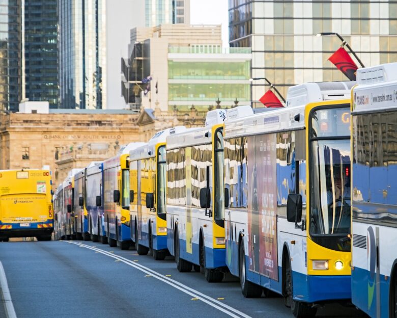 Brisbane, Australia - November 21, 2017: Rush hour congestion on Brisbane's Victoria Bridge with long line of buses stopped on dedicated busway, with city in background.