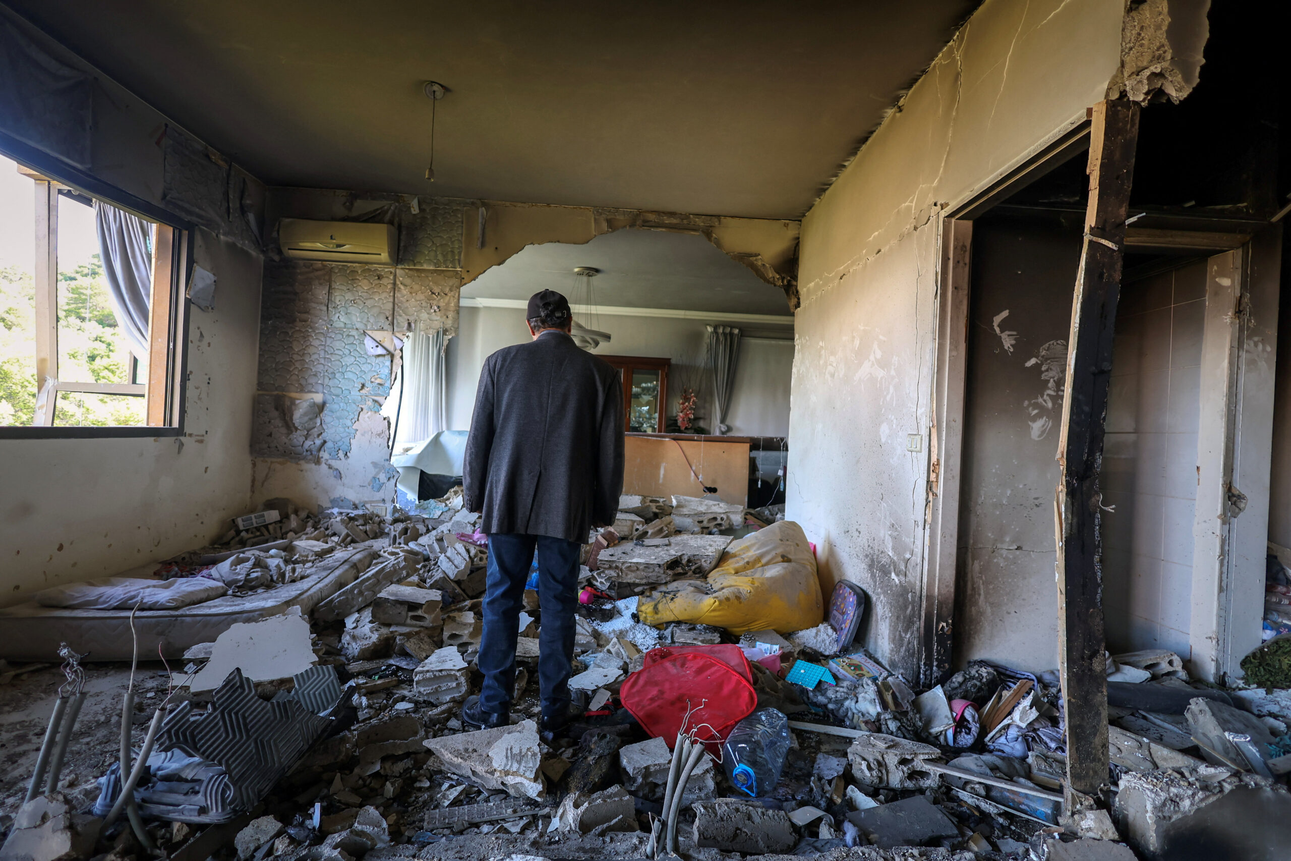 Aftermath of an Israeli strike in Beirut Abbas Qasem walks inside a house, damaged by an Israeli strike, following an escalation between Hezbollah and Israel, amid the U.S.-Israeli conflict with Iran, in Beirut, Lebanon, March 24, 2026. REUTERS/Amr Abdallah Dalsh
