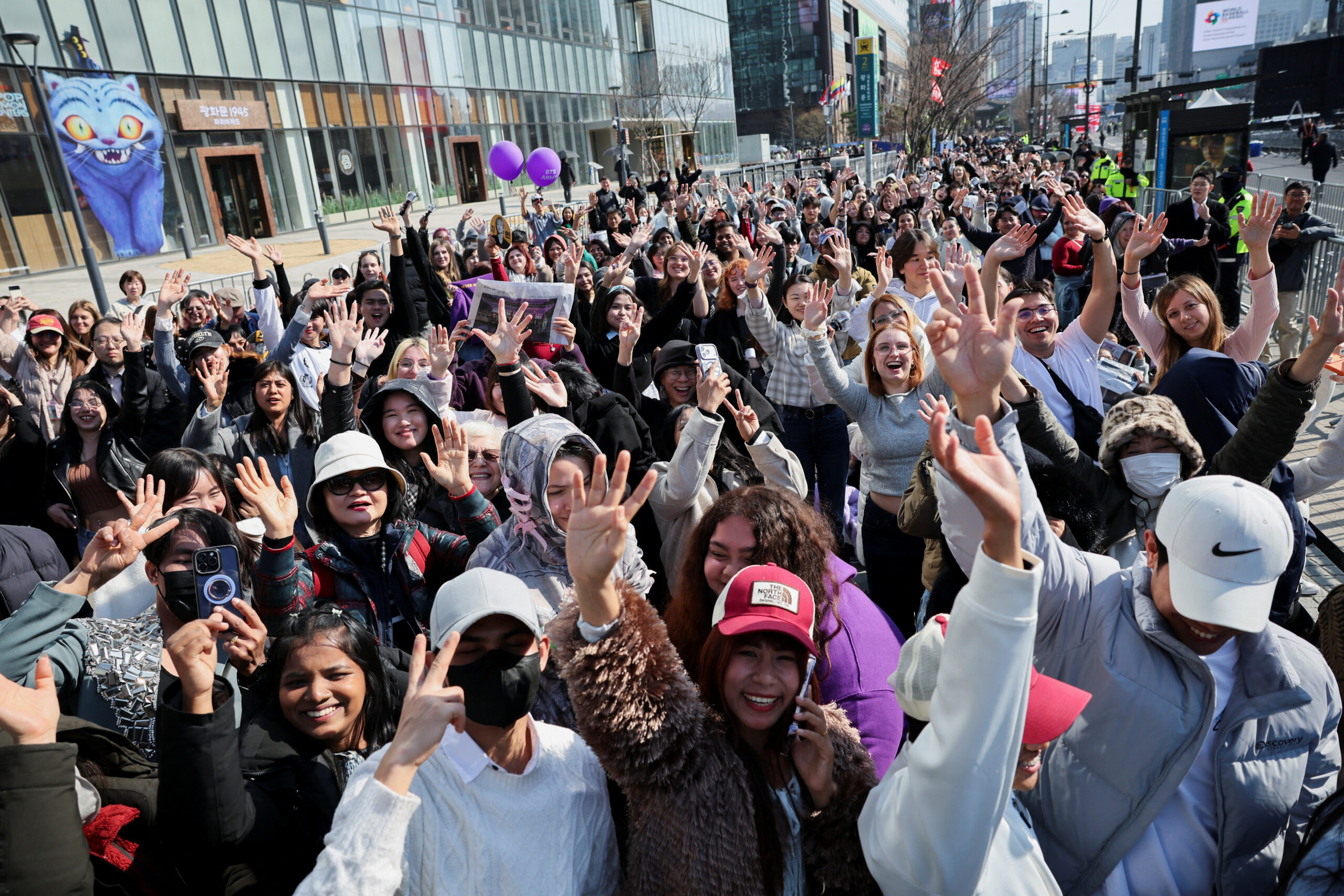 Fans of Kpop group BTS cheer ahead of 'BTS The Comeback Live Arirang' concert as they wait near the concert venue, in central Seoul, South Korea, March 21, 2026. REUTERS/Kim Hong-ji